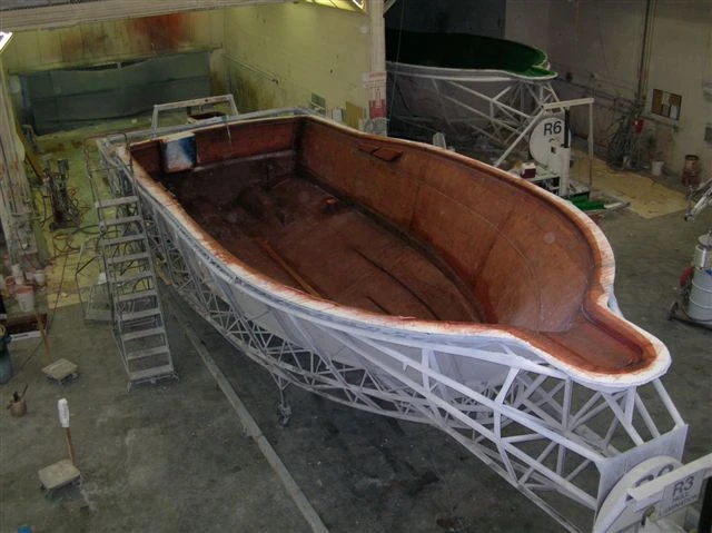 Boat hull mould supported by a steel frame in supplied marine training archive
