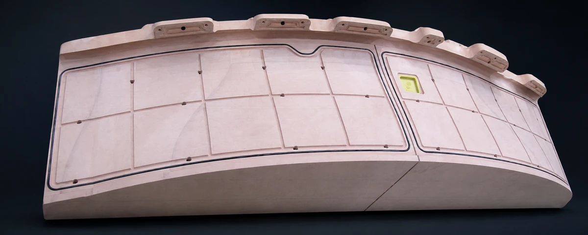 Curved trimming fixture with machined vacuum channels and sealing grid from EPTEK technical review