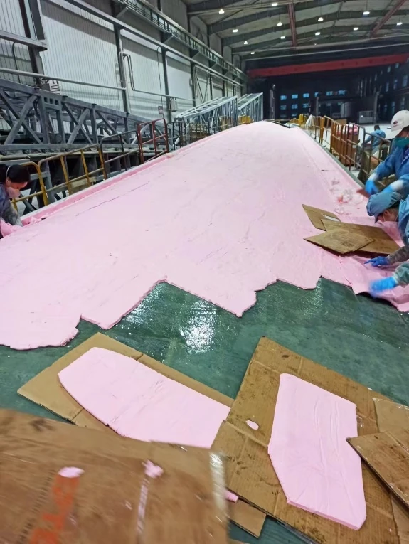 Paste working layer being built on a wind blade master pattern